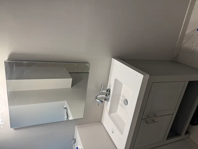 a bathroom with a toilet and a sink
