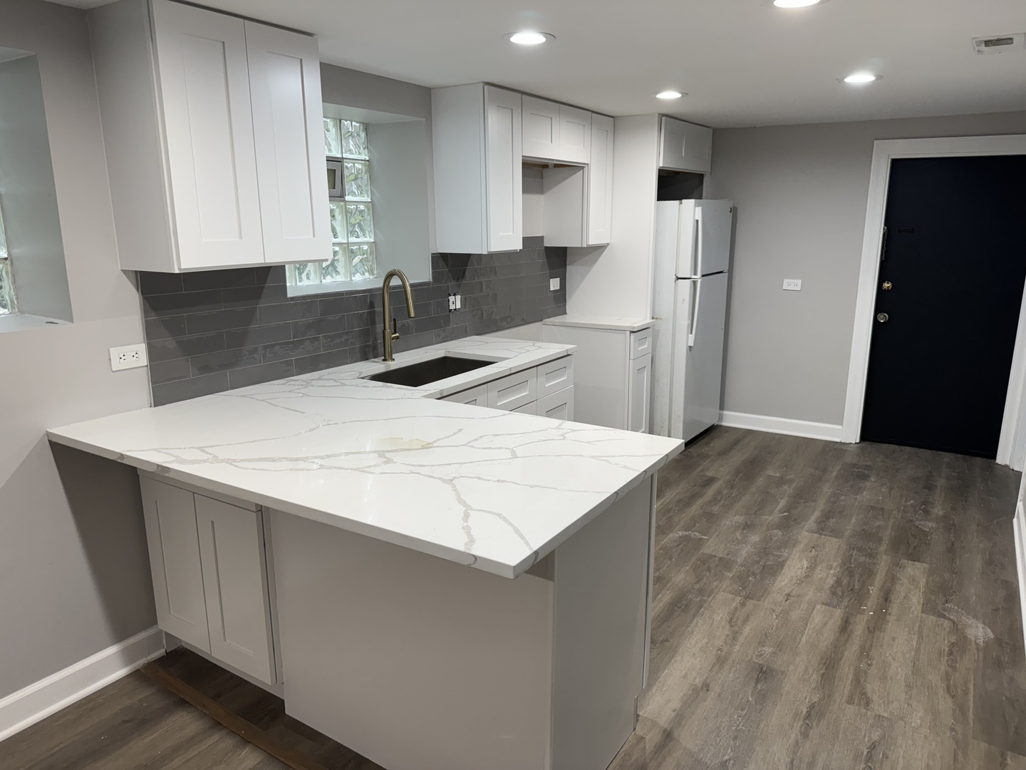 2617 West Rascher Avenue, Unit G Chicago, IL 60625 - Photo 15 of 15 a kitchen with stainless steel appliances a refrigerator sink and microwave