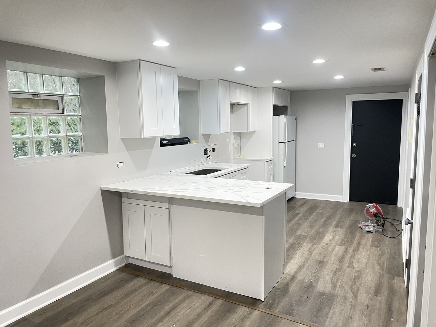 2617 West Rascher Avenue, Unit G Chicago, IL 60625 - Photo 3 of 15 a kitchen with kitchen island a sink stainless steel appliances and window