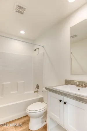 a bathroom with a sink a toilet and a bathtub