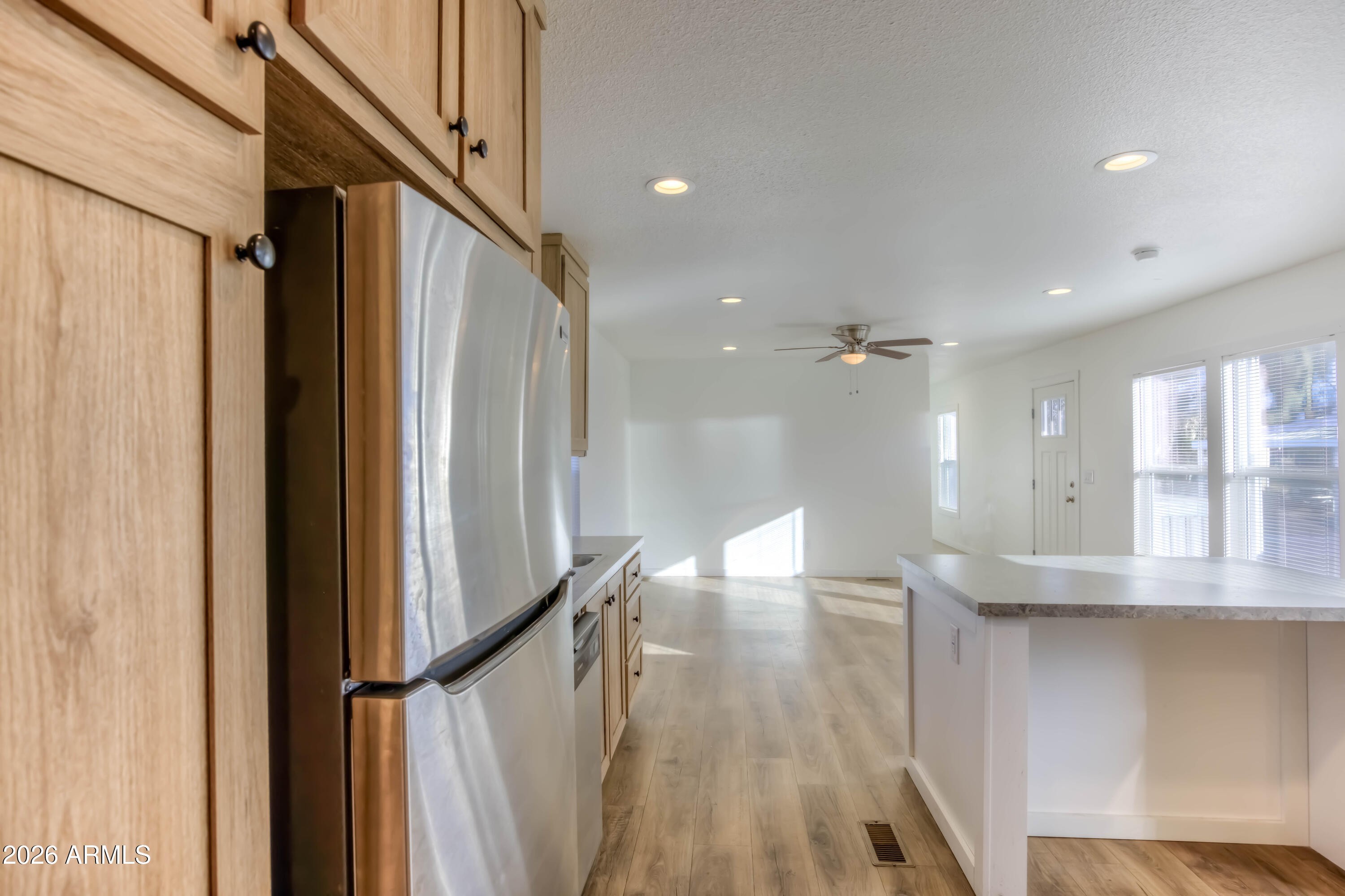 1325 West Silverlake Road, Unit 9 Tucson, AZ 85713 - Photo 6 of 29 a view of a hallway with wooden floor and staircase