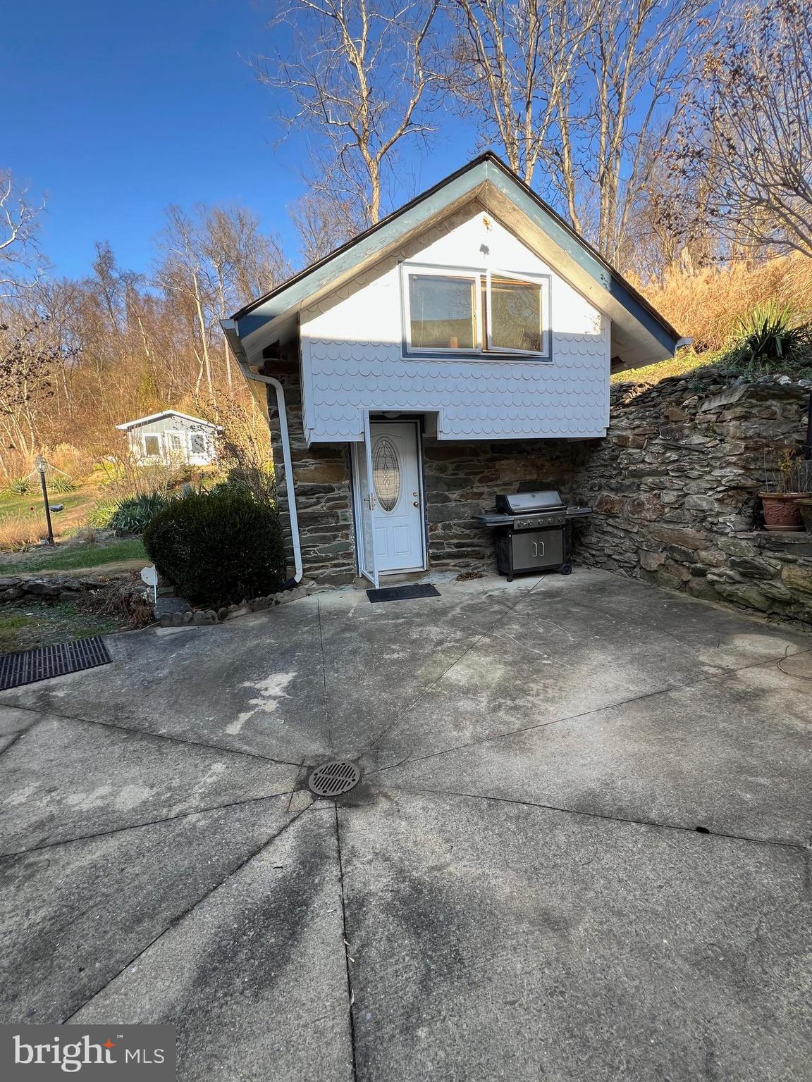 2834 East Boss Arnold Road Jefferson, MD 21755 - Photo 13 of 16 a front view of a house with a garage
