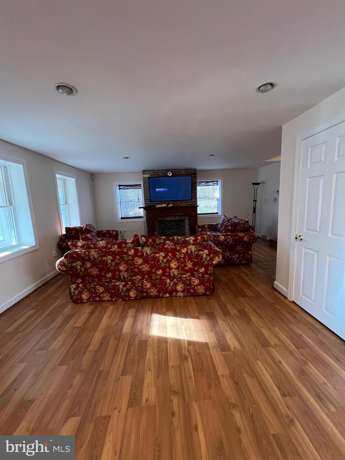 2834 East Boss Arnold Road Jefferson, MD 21755 - Photo 3 of 16 a living room with furniture and a wooden floor