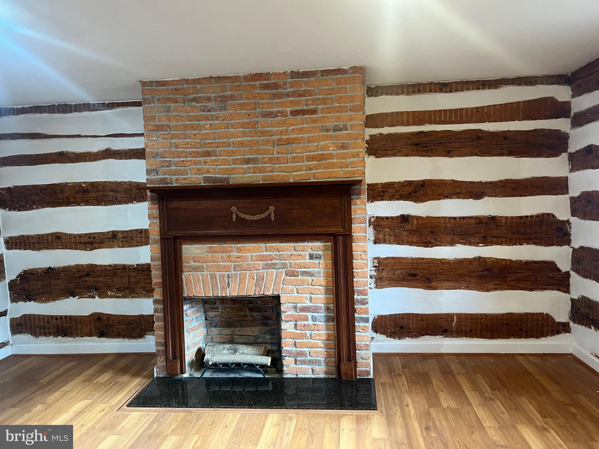 2834 East Boss Arnold Road Jefferson, MD 21755 - Photo 6 of 16 a view of a living room with a fireplace and a fireplace