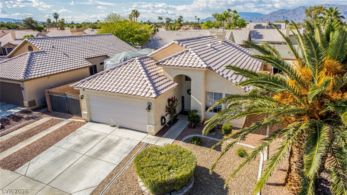 5112 West Camino Del Rancho Las Vegas, NV 89130 - Photo 39 of 44 This desert oasis features a tiled roof and a spacious driveway.