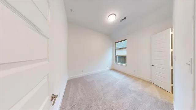 a view of an empty room and window