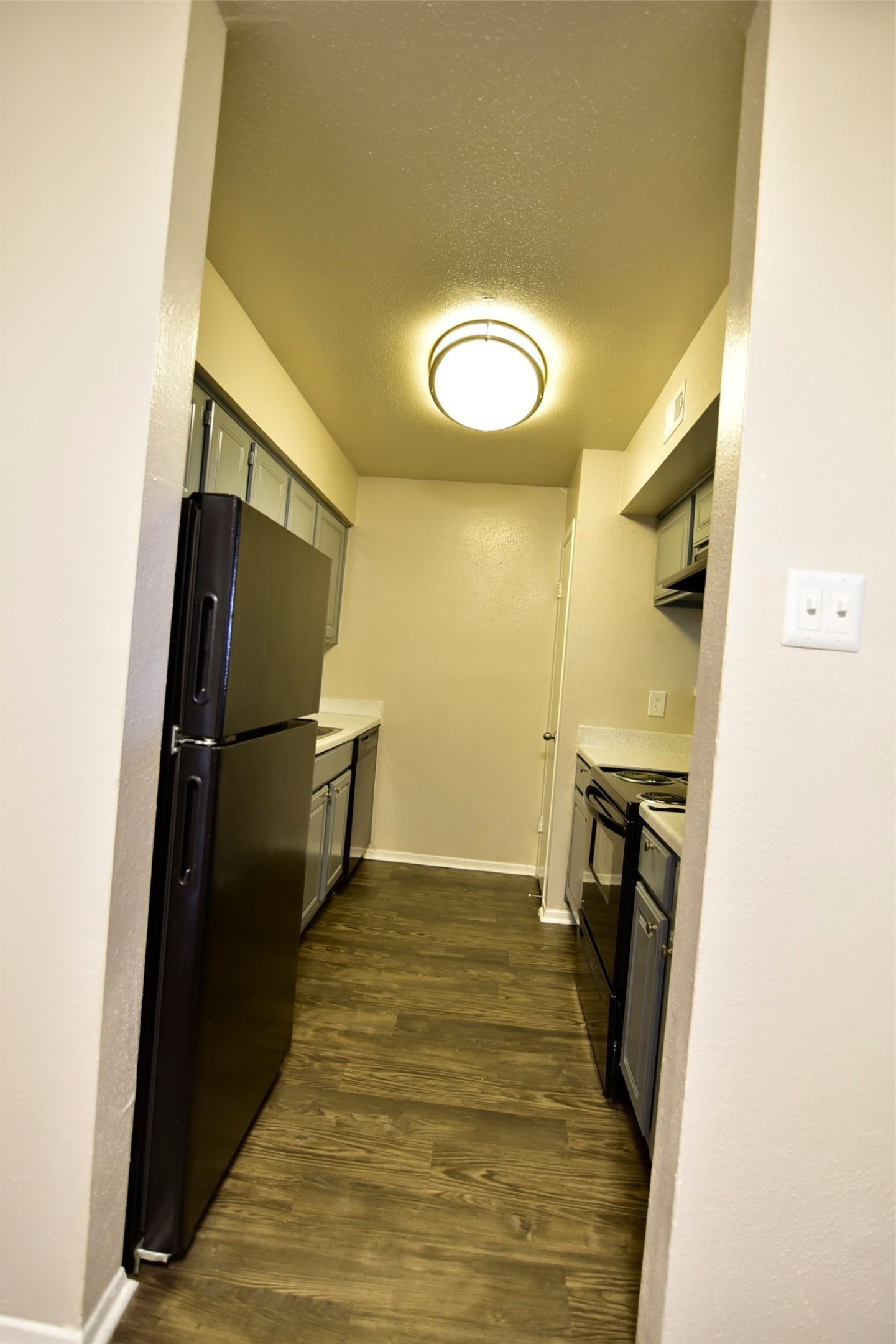 14403 Pavilion Point, Unit 488 Houston, TX 77083 - Photo 5 of 15 a view of a livingroom with wooden floor