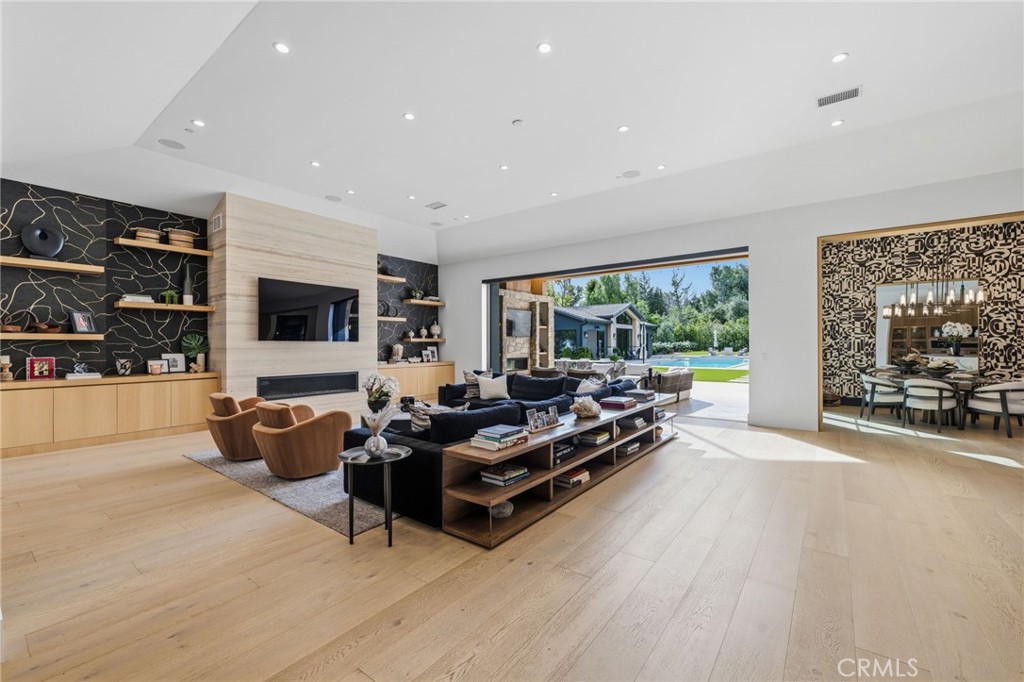 5241 Twin Oaks Road Hidden Hills, CA 91302 - Photo 21 of 69 a living room with furniture and a flat screen tv