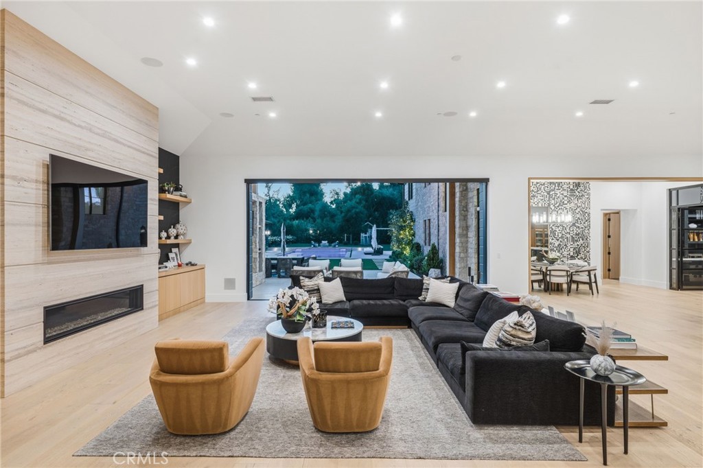 5241 Twin Oaks Road Hidden Hills, CA 91302 - Photo 22 of 69 a living room with furniture and a flat screen tv
