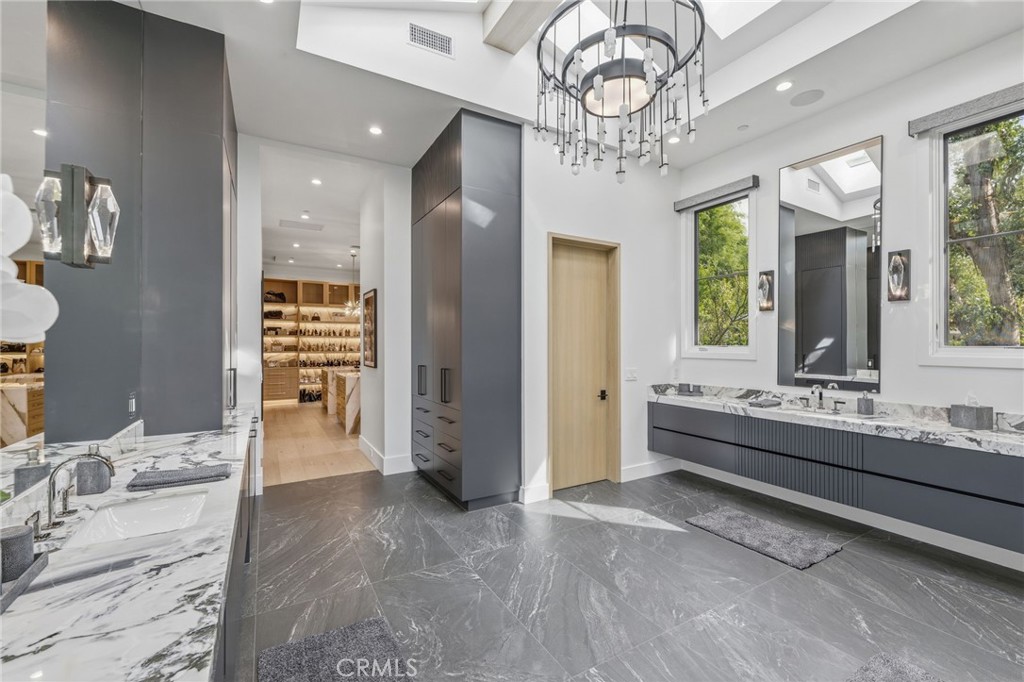5241 Twin Oaks Road Hidden Hills, CA 91302 - Photo 41 of 69 a large room with chandelier
