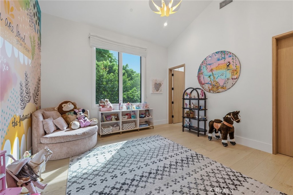 5241 Twin Oaks Road Hidden Hills, CA 91302 - Photo 45 of 69 a living room with furniture and a large window