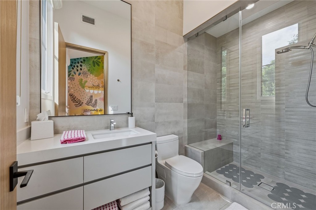 5241 Twin Oaks Road Hidden Hills, CA 91302 - Photo 46 of 69 a bathroom with a sink toilet and shower