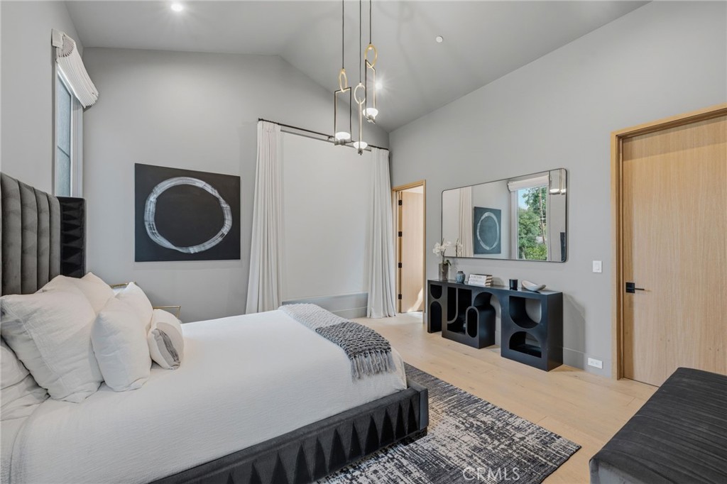 5241 Twin Oaks Road Hidden Hills, CA 91302 - Photo 47 of 69 a bedroom with a bed and a table in it