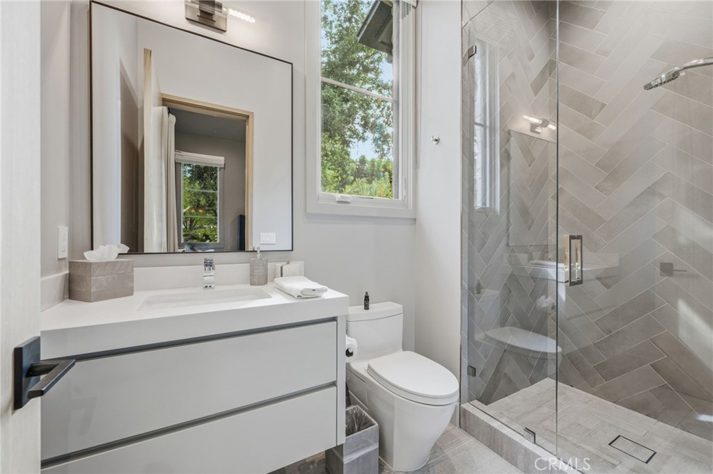 5241 Twin Oaks Road Hidden Hills, CA 91302 - Photo 49 of 69 a bathroom with a toilet sink and shower