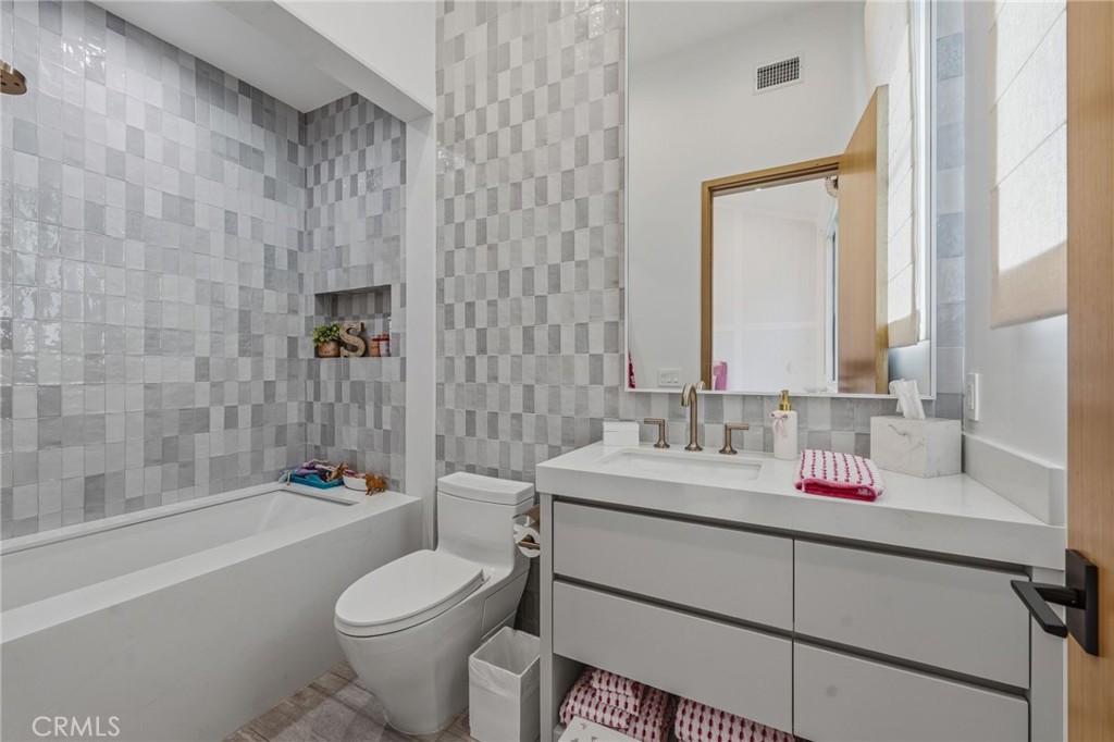 5241 Twin Oaks Road Hidden Hills, CA 91302 - Photo 51 of 69 a bathroom with a sink toilet and shower