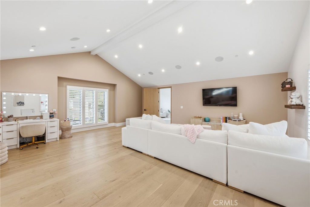 5241 Twin Oaks Road Hidden Hills, CA 91302 - Photo 54 of 69 a living room with furniture and a flat screen tv