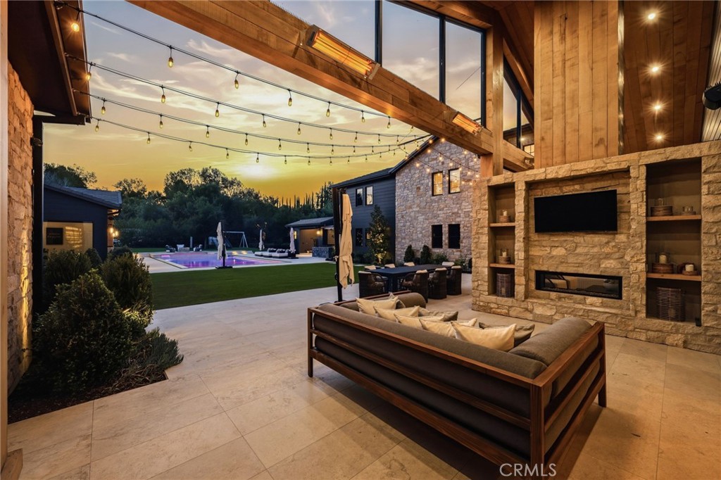 5241 Twin Oaks Road Hidden Hills, CA 91302 - Photo 6 of 69 a view of a patio with a table and chairs