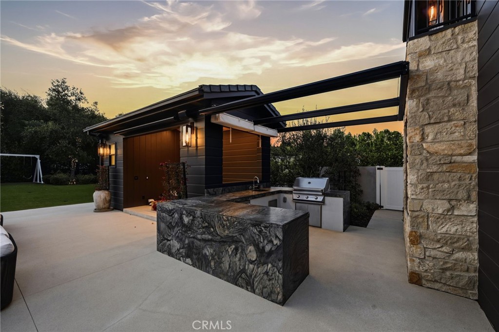 5241 Twin Oaks Road Hidden Hills, CA 91302 - Photo 68 of 69 a patio with yard table and chairs