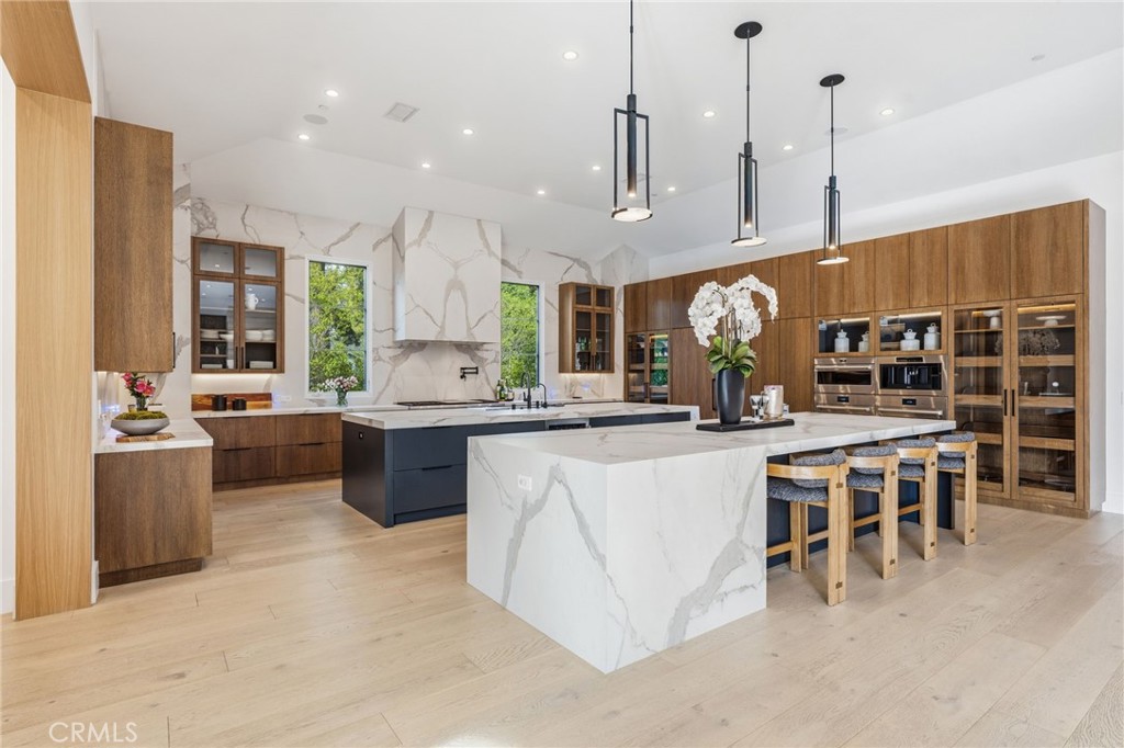 5241 Twin Oaks Road Hidden Hills, CA 91302 - Photo 10 of 69 a large kitchen with a lot of counter space and a sink