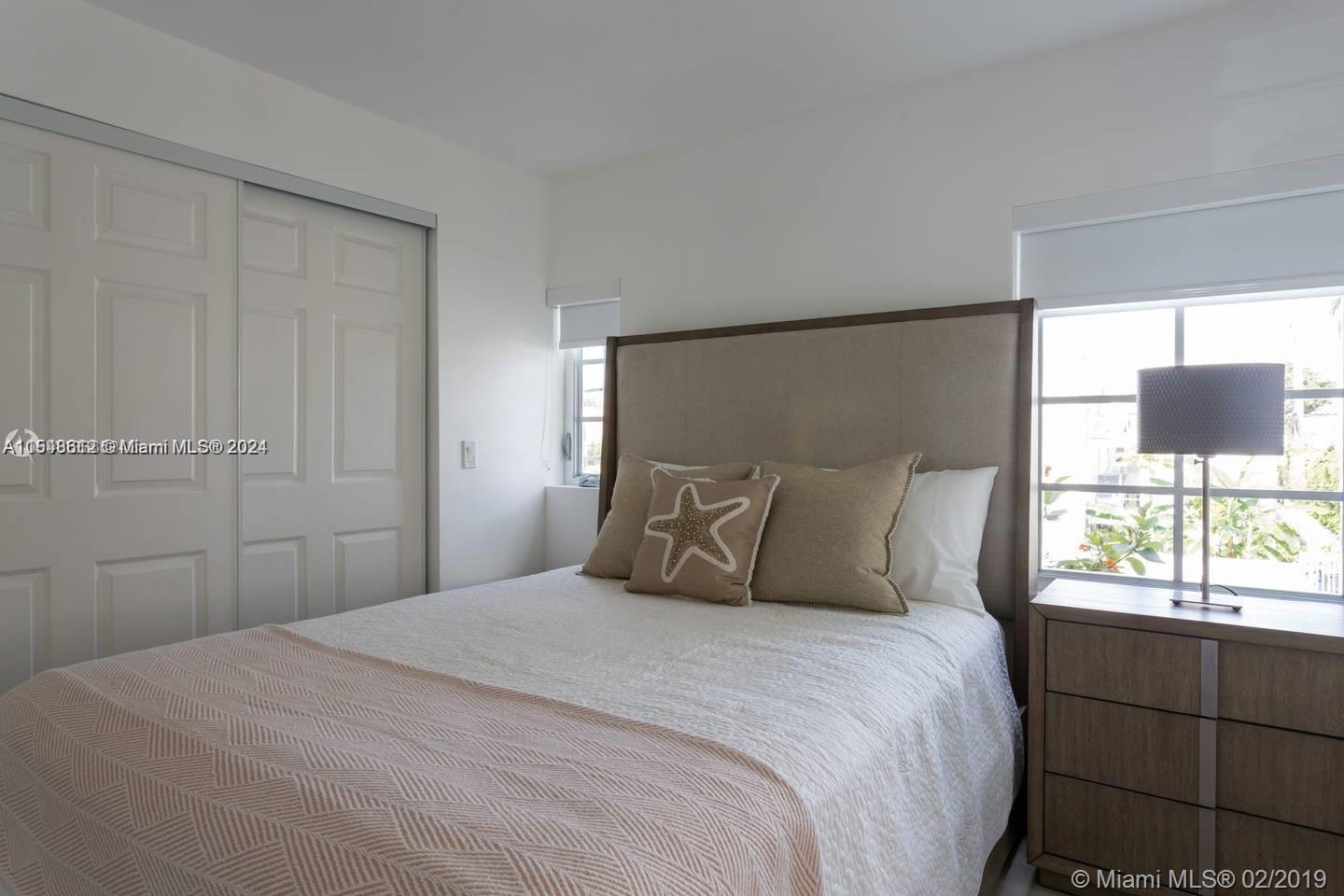 1450 Meridian Avenue, Unit 201 Miami Beach, FL 33139 - Photo 11 of 19 a bedroom with a bed and a window