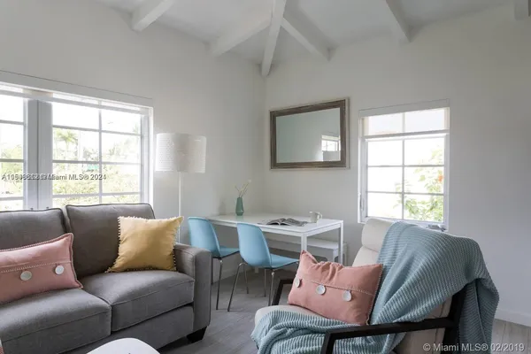 a living room with furniture and a window