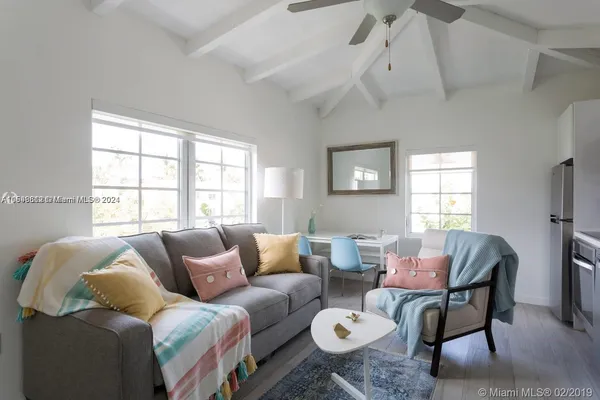 a living room with furniture and a window