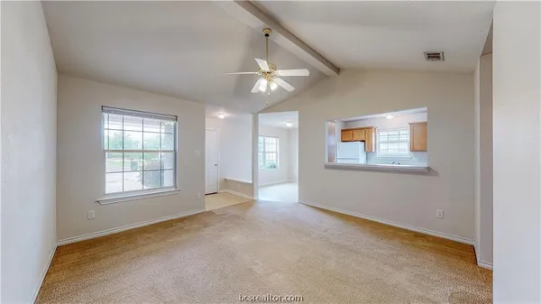 a view of an empty room with a window