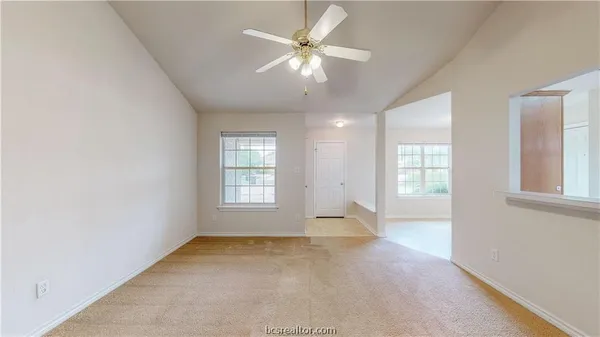 a view of an empty room with a window