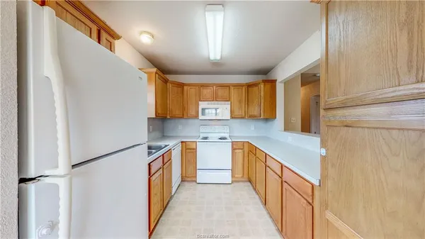 a kitchen with stainless steel appliances a sink and a stove