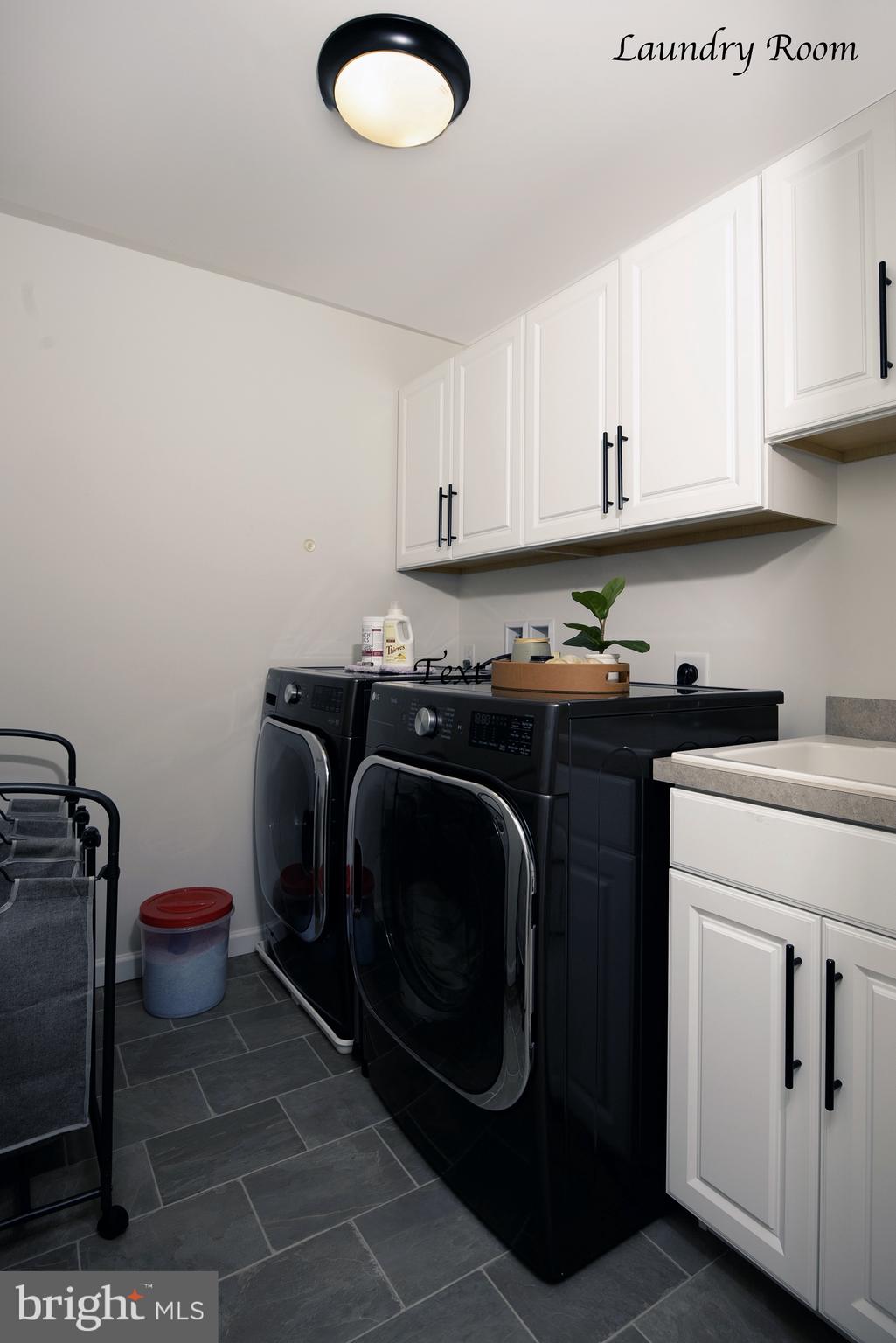194 Cool Springs Road North East, MD 21901 - Photo 31 of 39 a utility room with sink dryer and washer