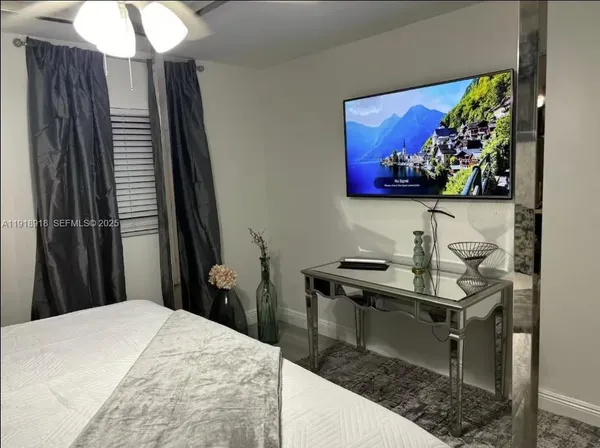 a bedroom with a bed and a table