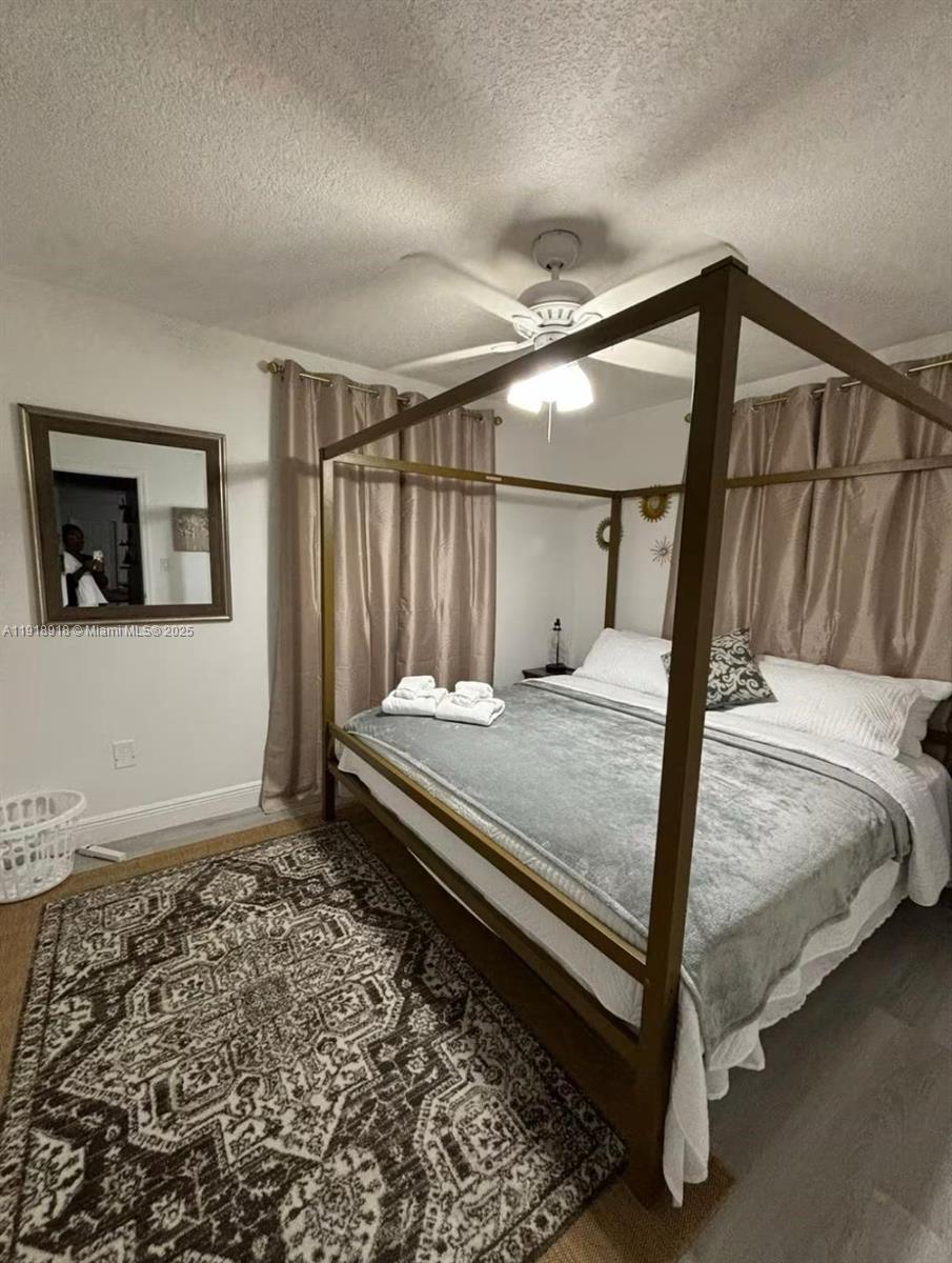 St. Lucie Estates-Broadway Stuart, FL 34996 - Photo 6 of 12 a bedroom with a bed next to a window