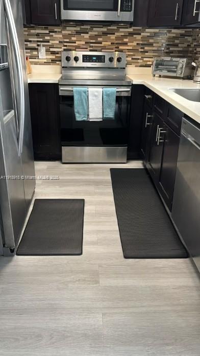 St. Lucie Estates-Broadway Stuart, FL 34996 - Photo 7 of 12 a kitchen with a stove and a sink