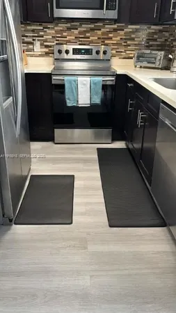 a bathroom with a shower and a sink