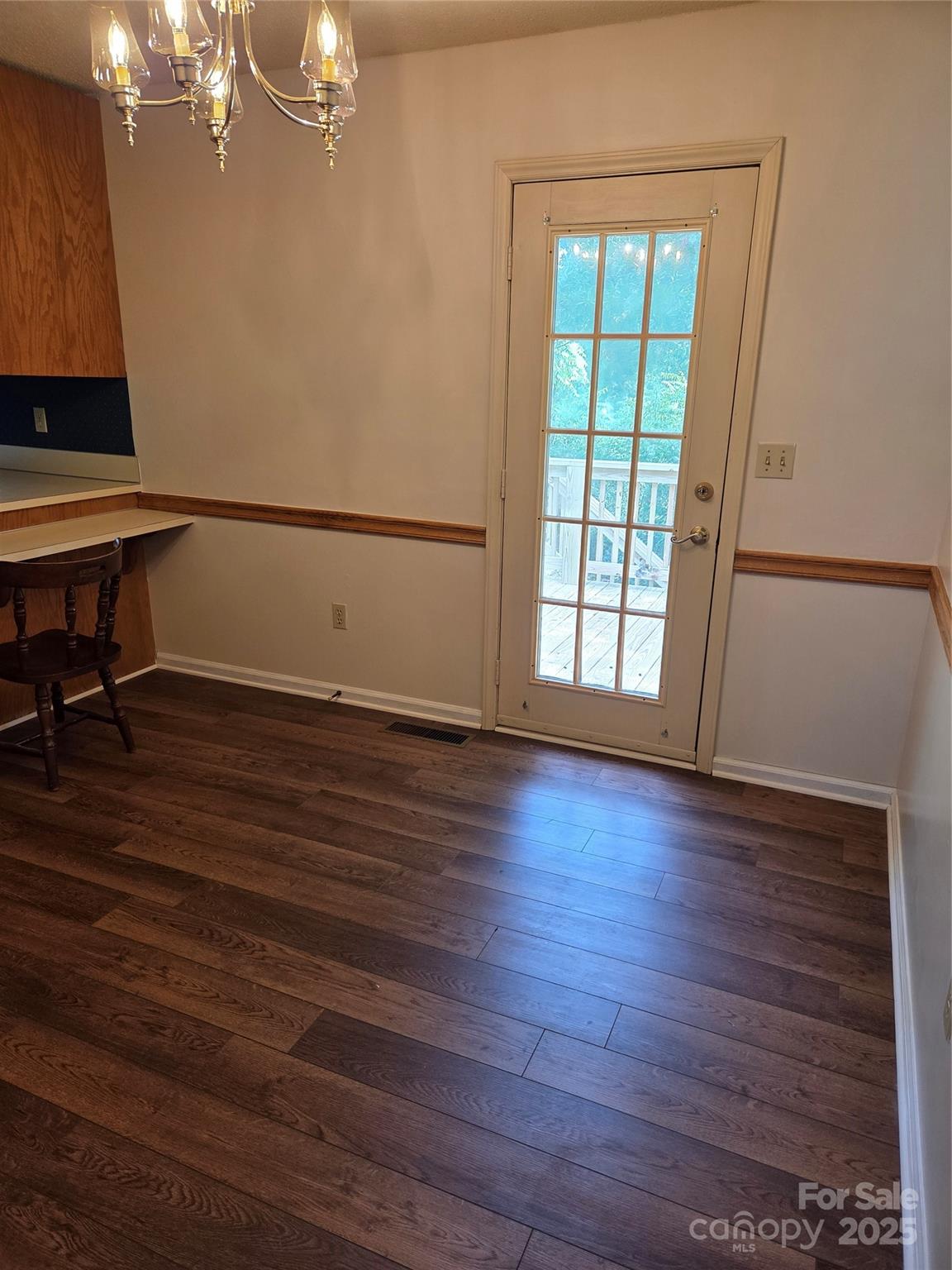 1203 Dudley Shoals Road Granite Falls, NC 28630 - Photo 13 of 32 a view of empty room with wooden floor and fan