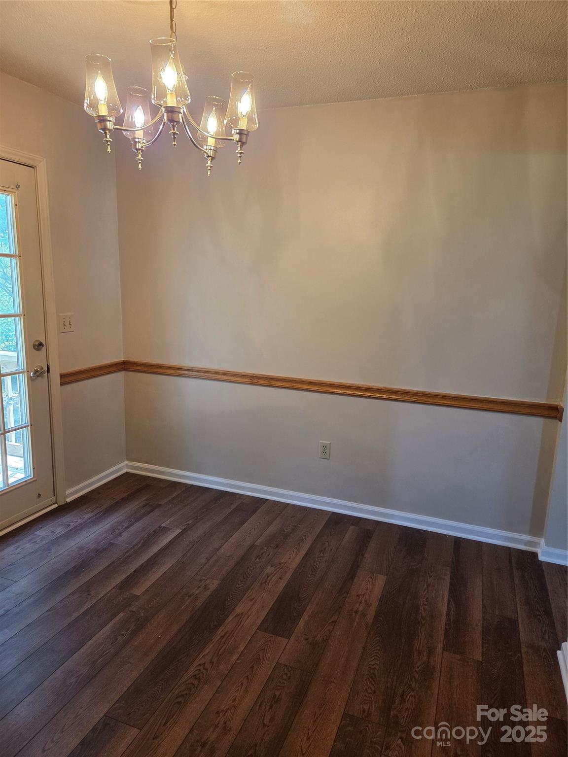 1203 Dudley Shoals Road Granite Falls, NC 28630 - Photo 15 of 32 a view of wooden floor and chandelier in a room