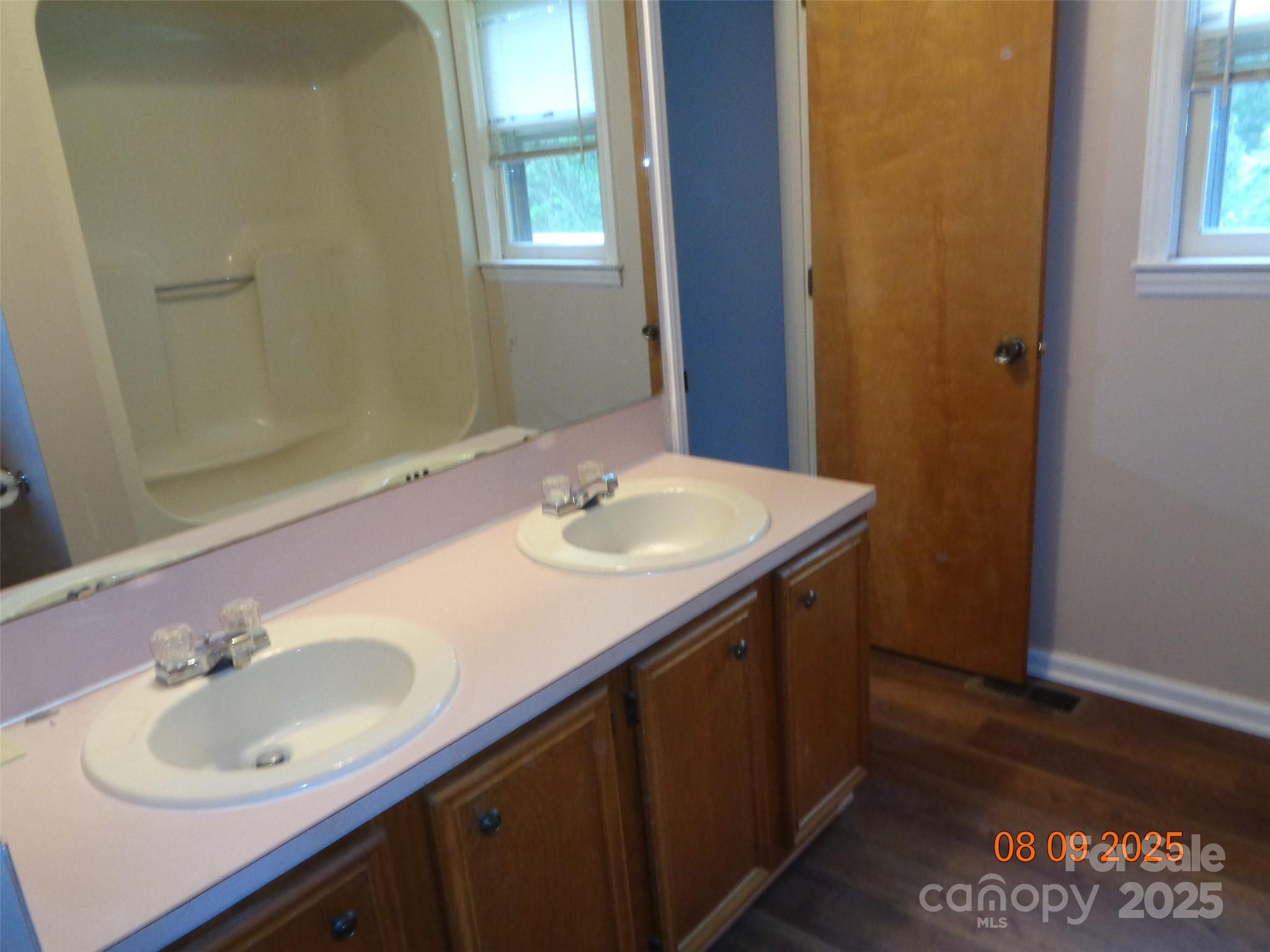 1203 Dudley Shoals Road Granite Falls, NC 28630 - Photo 20 of 32 a bathroom with a sink and a mirror