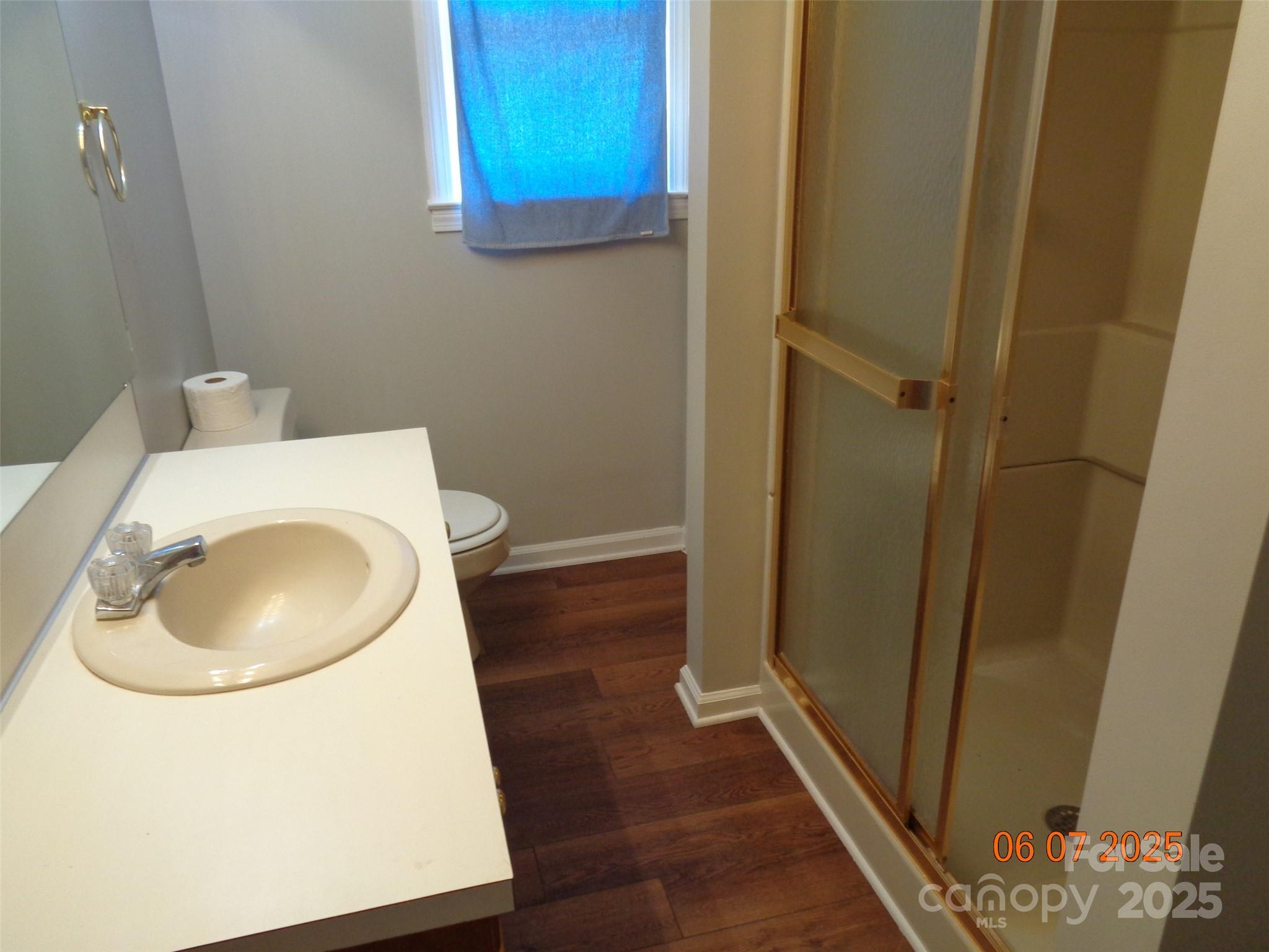 1203 Dudley Shoals Road Granite Falls, NC 28630 - Photo 25 of 32 a bathroom with a toilet and a sink