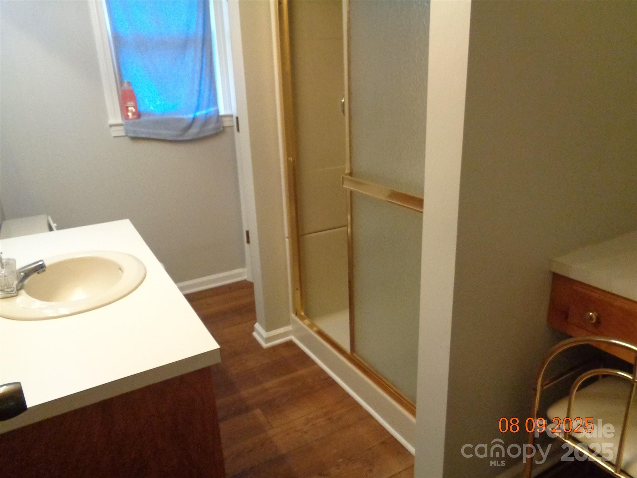 1203 Dudley Shoals Road Granite Falls, NC 28630 - Photo 28 of 32 a bathroom with a sink and a mirror
