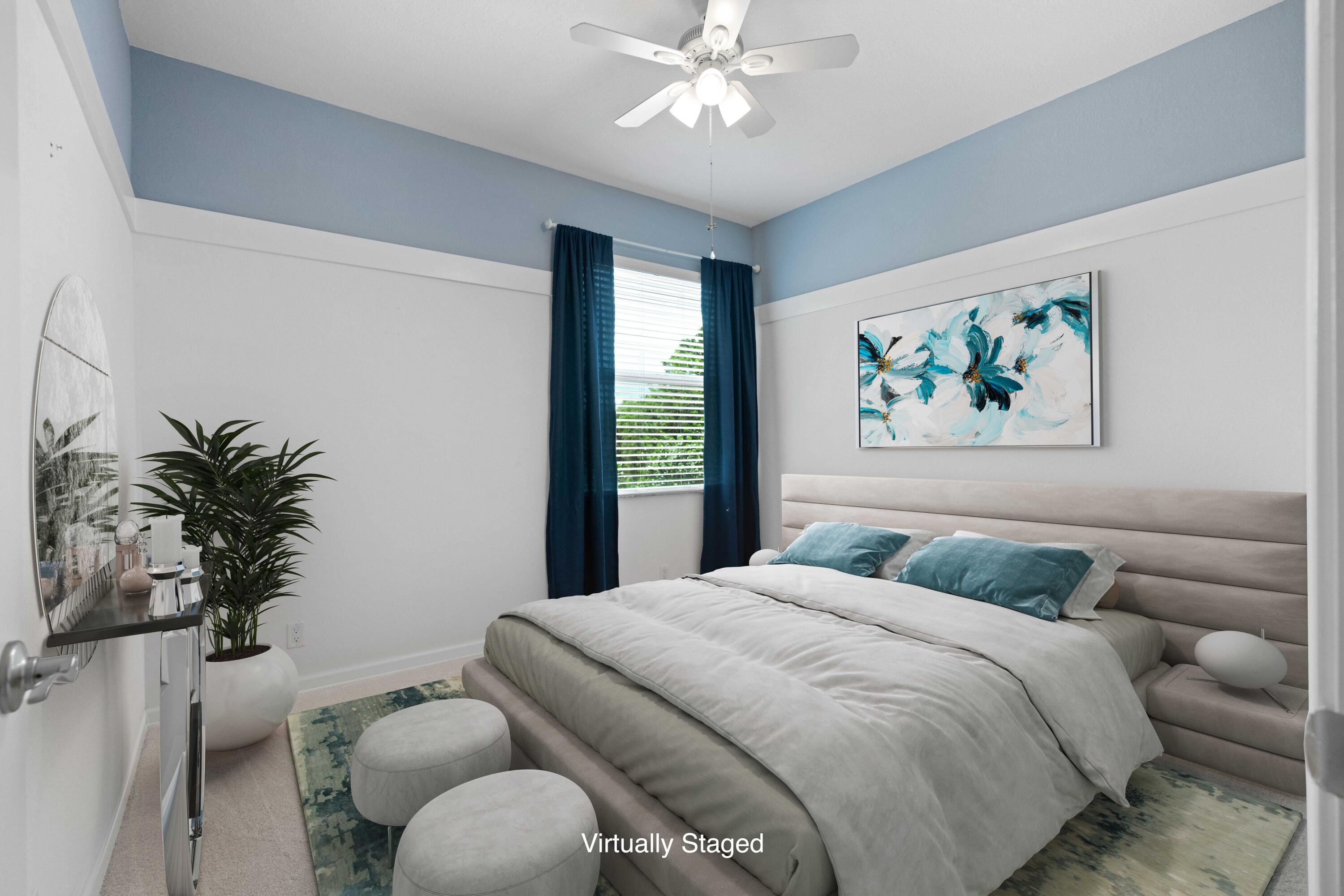 7018 Limestone Cay Road Jupiter, FL 33458 - Photo 11 of 23 a bedroom with a large bed and a chandelier