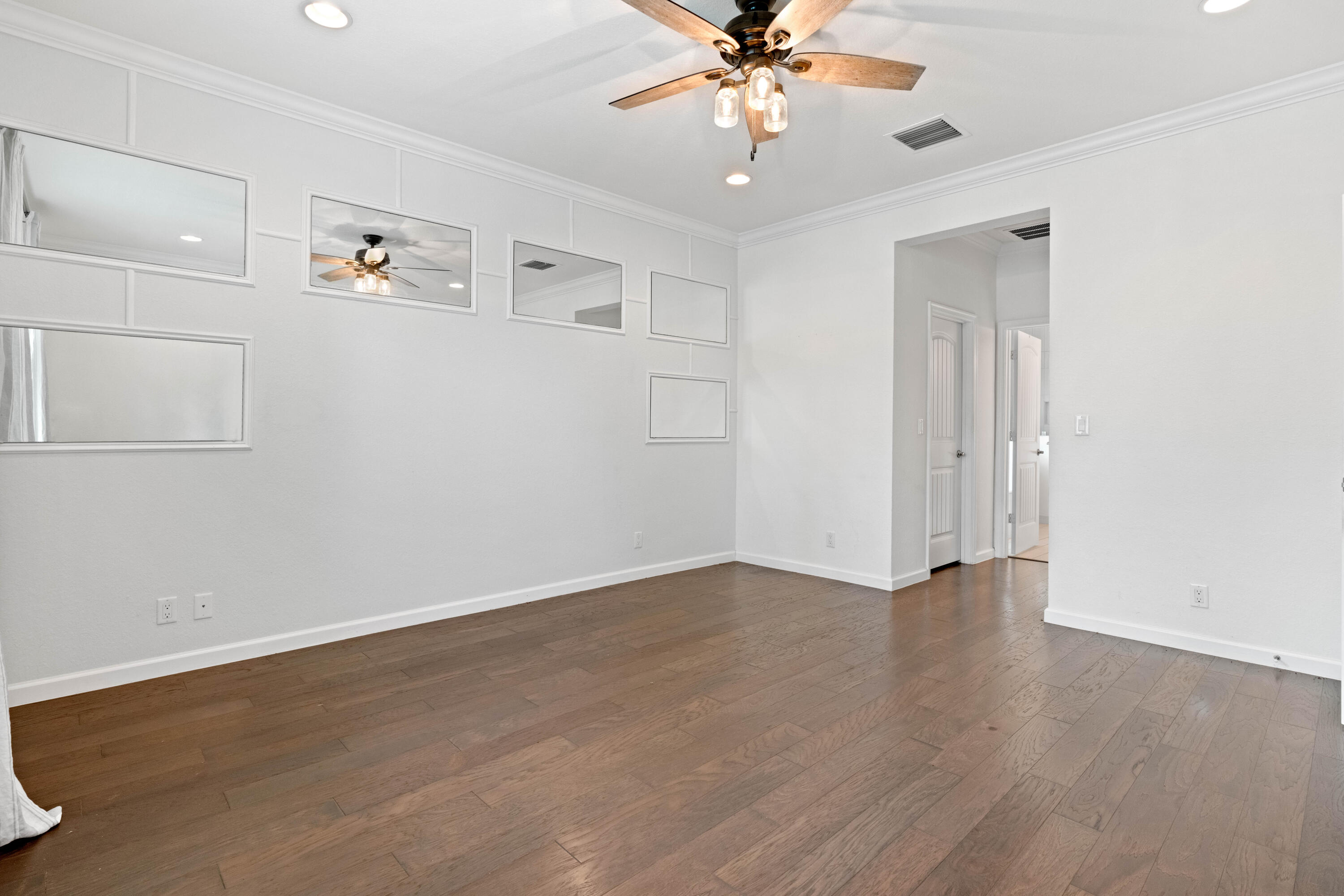 7018 Limestone Cay Road Jupiter, FL 33458 - Photo 19 of 23 a view of an empty room with a fan