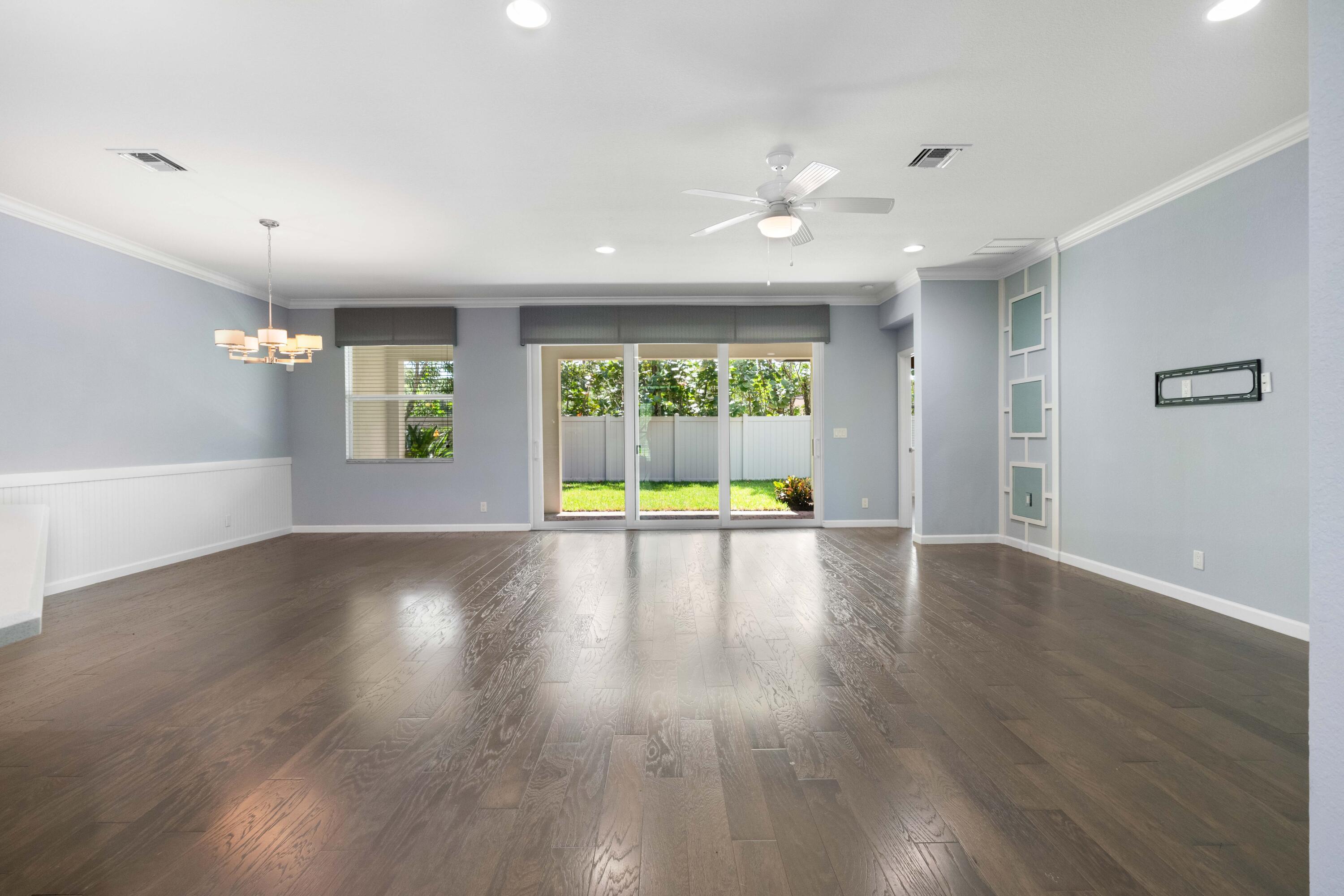 7018 Limestone Cay Road Jupiter, FL 33458 - Photo 21 of 23 a view of an empty room with wooden floor and a window