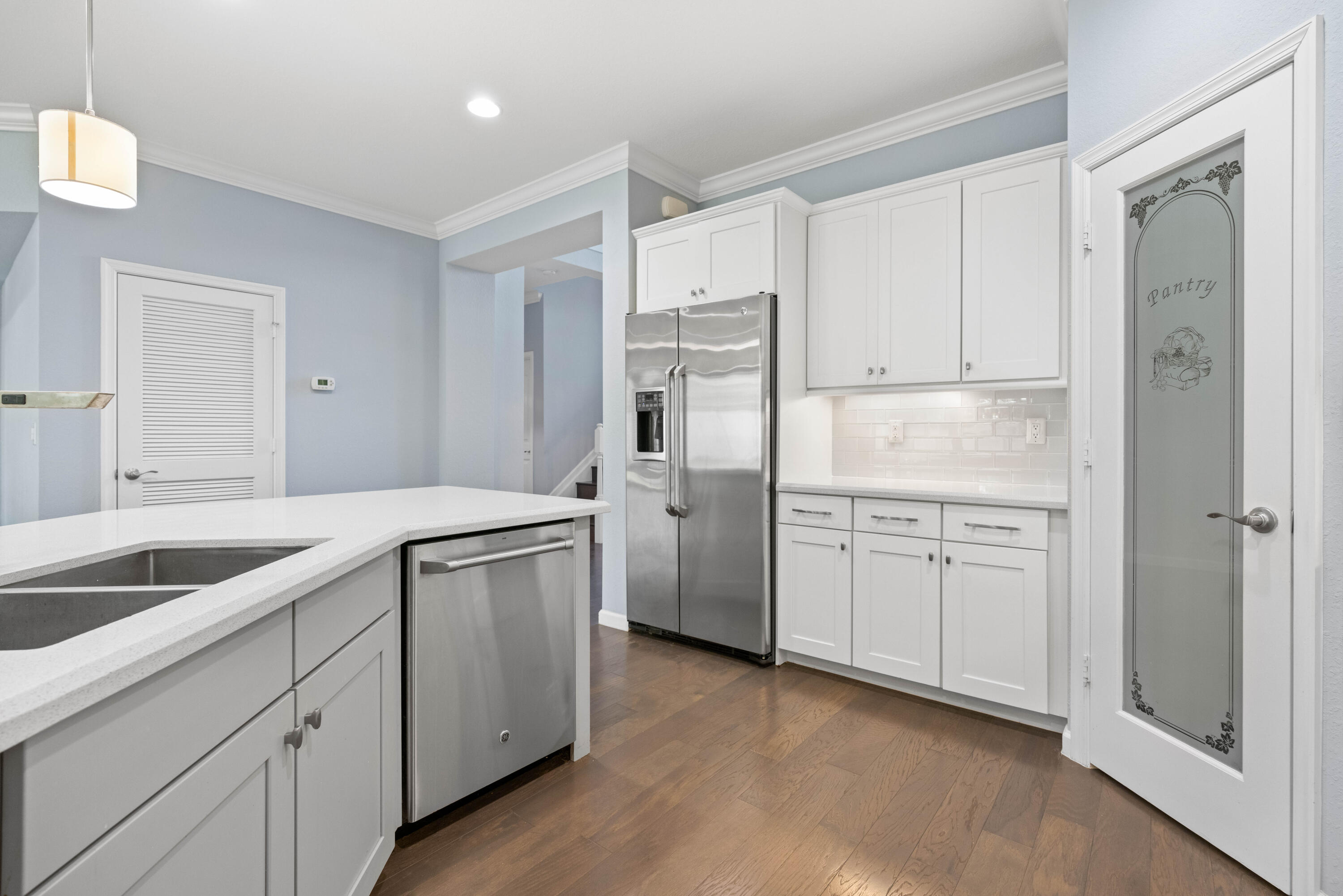 7018 Limestone Cay Road Jupiter, FL 33458 - Photo 4 of 23 a kitchen with white cabinets and white appliances