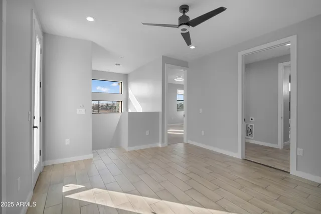 a view of a room with large windows