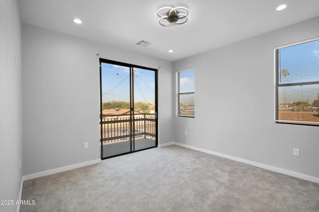 a view of a balcony with wooden floor