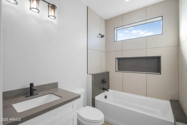 a bathroom with a sink a toilet and a bathtub