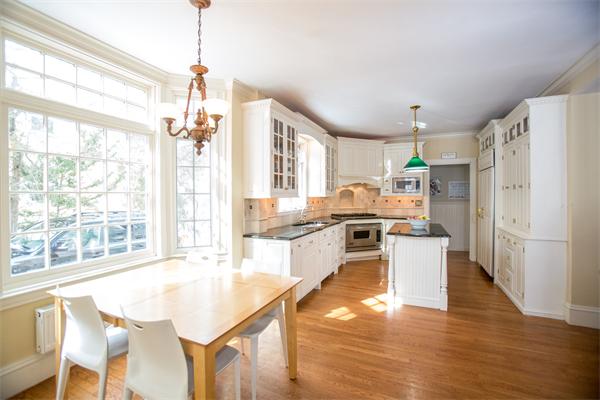 12 Glen Road Wellesley, MA 02481 - Photo 8 of 14 a large kitchen with a large window a refrigerator and wooden floor
