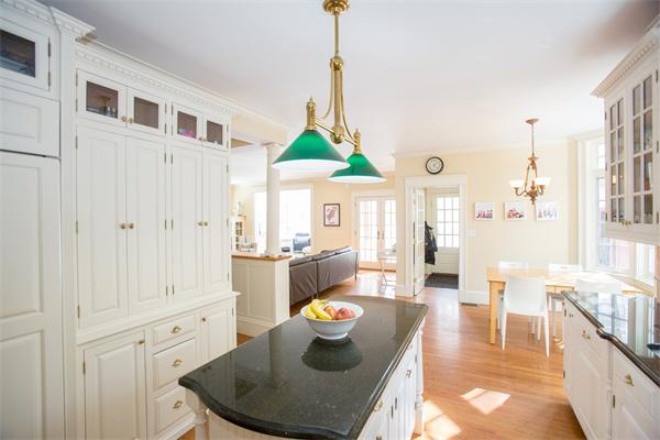 12 Glen Road Wellesley, MA 02481 - Photo 10 of 14 a dining room with furniture a window and a chandelier