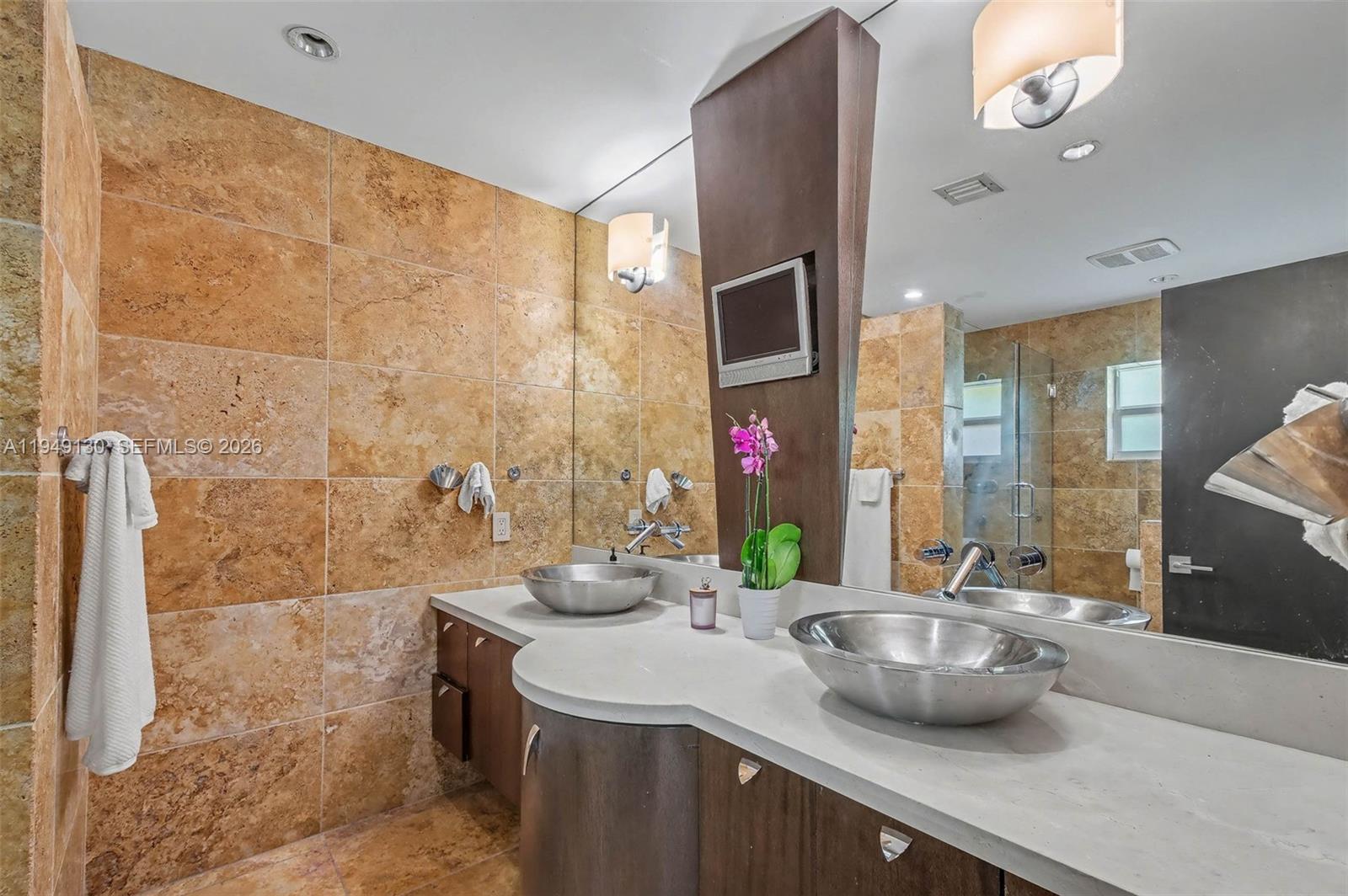 3097 Southwest 132nd Place Miami, FL 33175 - Photo 12 of 26 a bathroom with a sink and a mirror