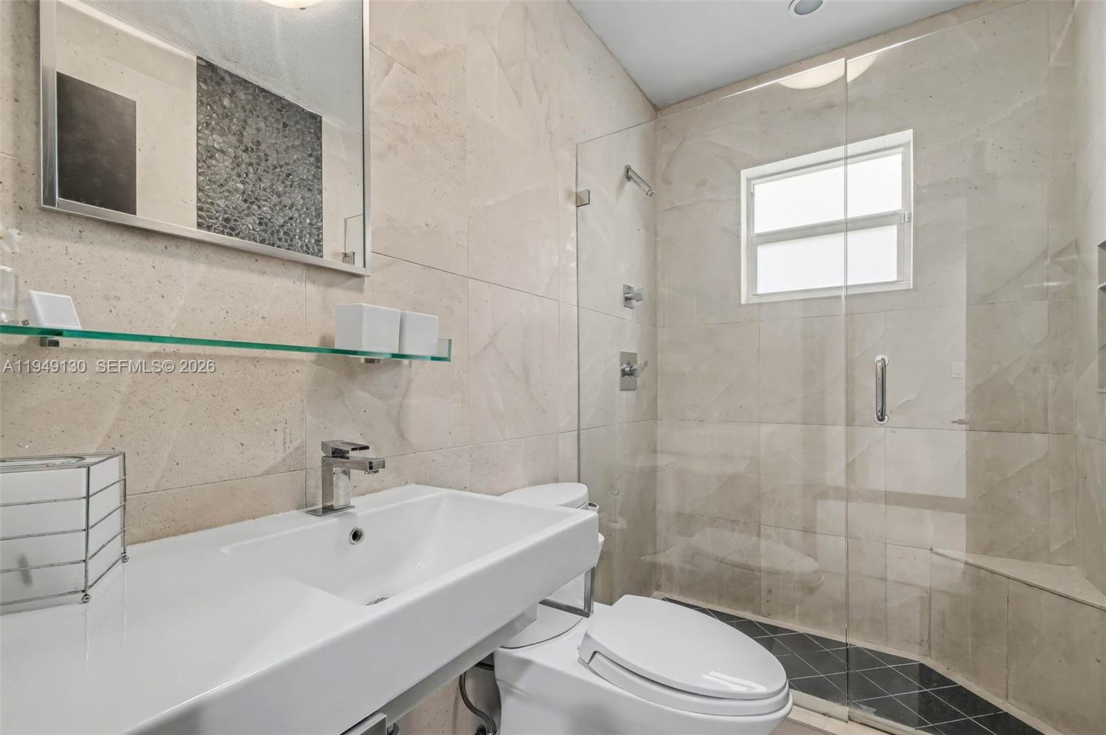 3097 Southwest 132nd Place Miami, FL 33175 - Photo 14 of 26 a bathroom with a sink toilet and shower